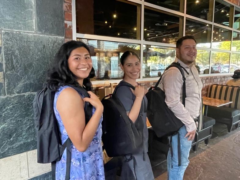 Three of the POE Organization mentees with their Paragon backpacks. From left to right is Daisy, Jackie, and Alfonso.