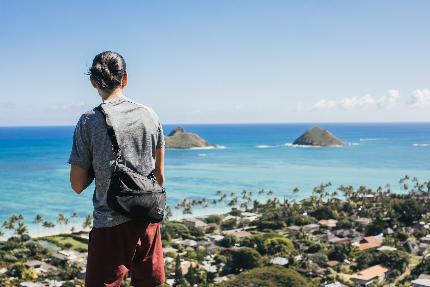 Model wearing PCSB looks out at the Hawaiian landscape