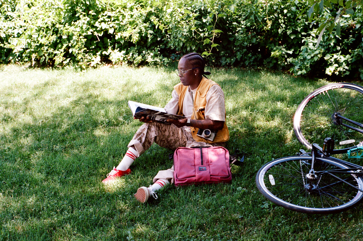 lifestyle visible^^A person reading with a Raspberry Ballistic Pilot next to them.