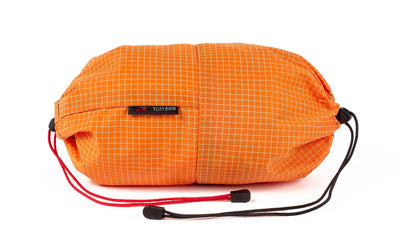 visible variant TB09375-ZD TB09376-ZD^^An Aeronaut 30 Travel Laundry Stuff Sack in Zest (orange with white grid) 200 Halcyon.