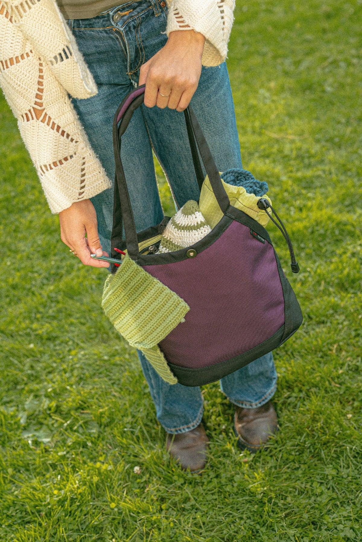 lifestyle visible^^A person holding a Little Swift by the handles.