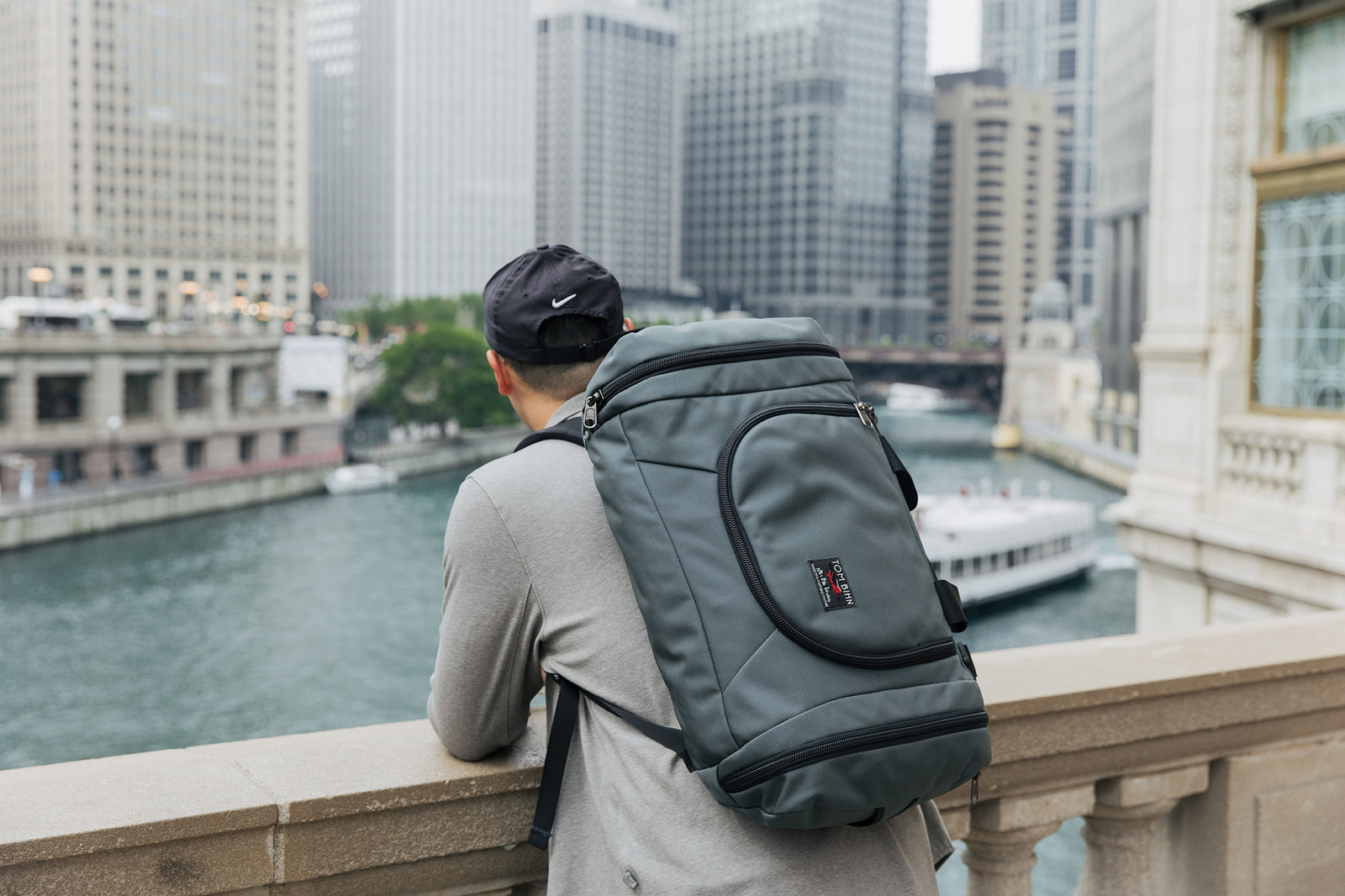visible lifestyle^^Person wearing the Aeronaut 30 as a backpack overlooking a canal.