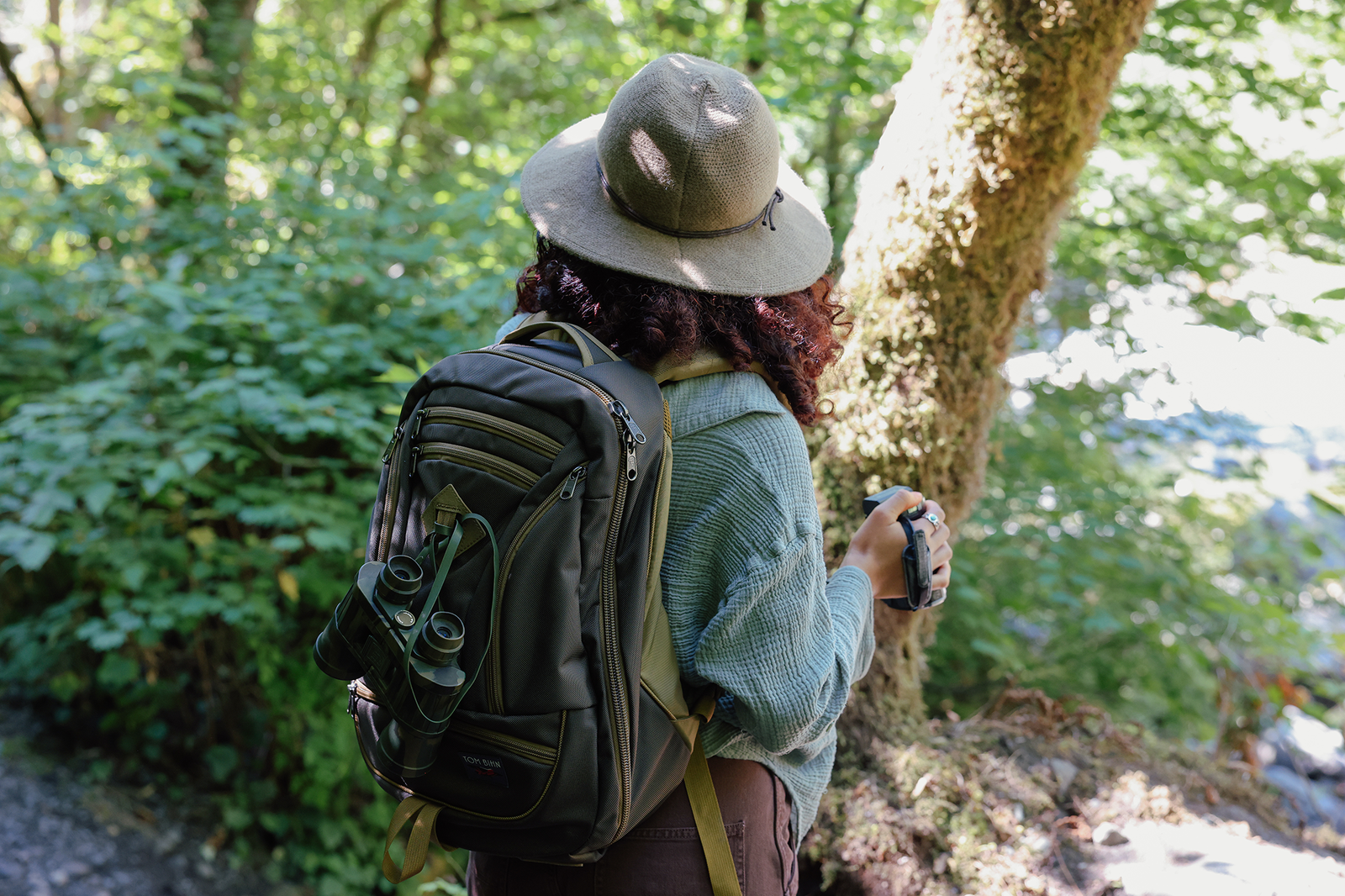 visible lifestyle^^Guide's Edition Synik 26 Saguaro person hiking through trees