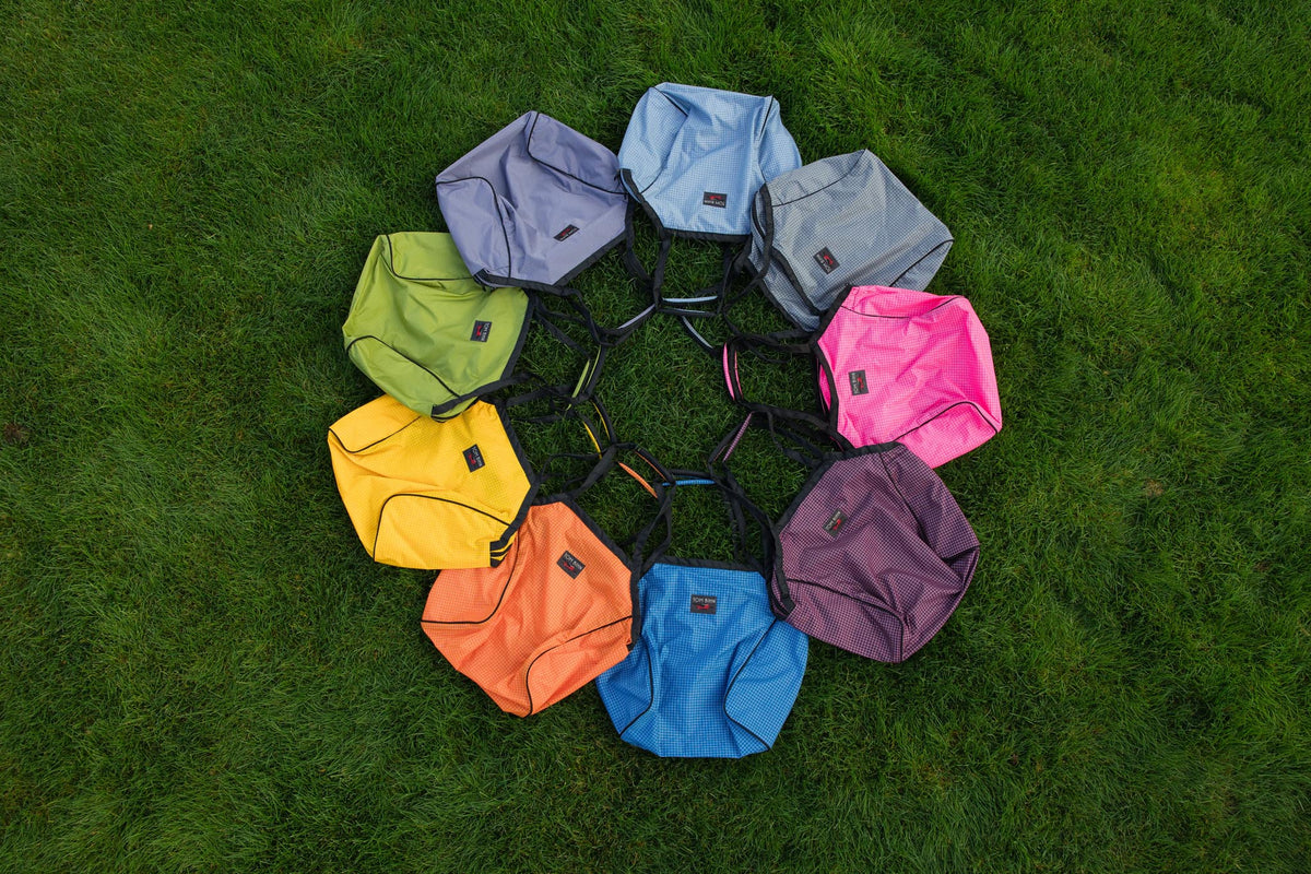 visible lifestyle^^All the Large Zip-Top Shop Bags in a circle on grass.