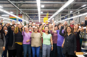 The TOM BIHN Crew holding up their CPR certification cards