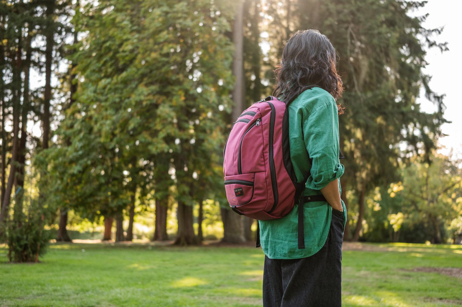 visible lifestyle^^A person wearing a Synik 26 in a wooded area