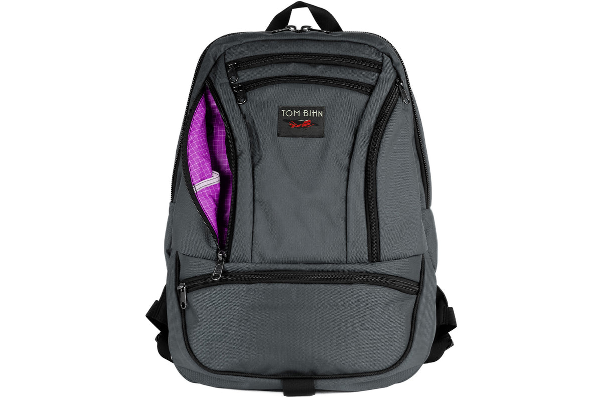 visible variant TB0113-GKUD^^A Nebulous Grey Ballistic Synapse 25 with the side pocket open showing the Ultraviolet Halcyon lining color.