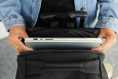 visible lifestyle^^A person removing a laptop from the device pocket of the Bixi