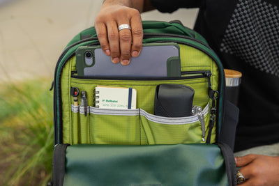 visible lifestyle^^A person removing a tablet from the admin pocket of the BIxi.