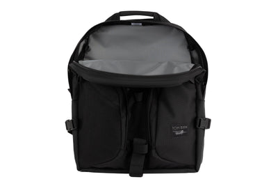 visible variant TB0114-BKGL^^The Brain Bag in Nebulous Grey (dark grey) Ballistic with the front main compartment zipper opened to reveal its Mountain Grey (grey with light grey grid) 210 Cerylon interior.