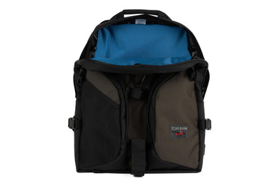 visible variant TB0114-RKOL^^The Brain Bag in Ursa (brown-grey) Ballistic with the front main compartment zipper opened to reveal its Cobalt (blue with light blue grid) 210 Cerylon interior.