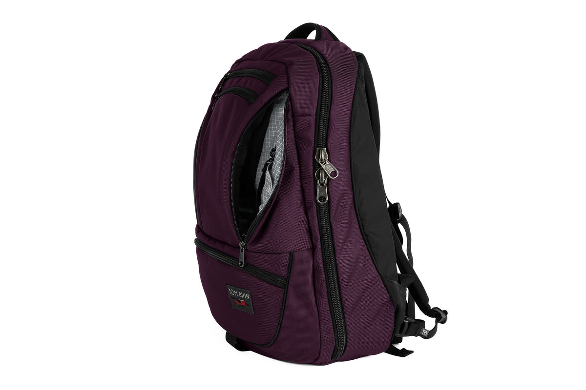 visible variant TB0121-UKND^^The Synik 30 in Aubergine (dark purple) 525 Ballistic with a Northwest Sky (light grey with white grid) 200 Halcyon interior.