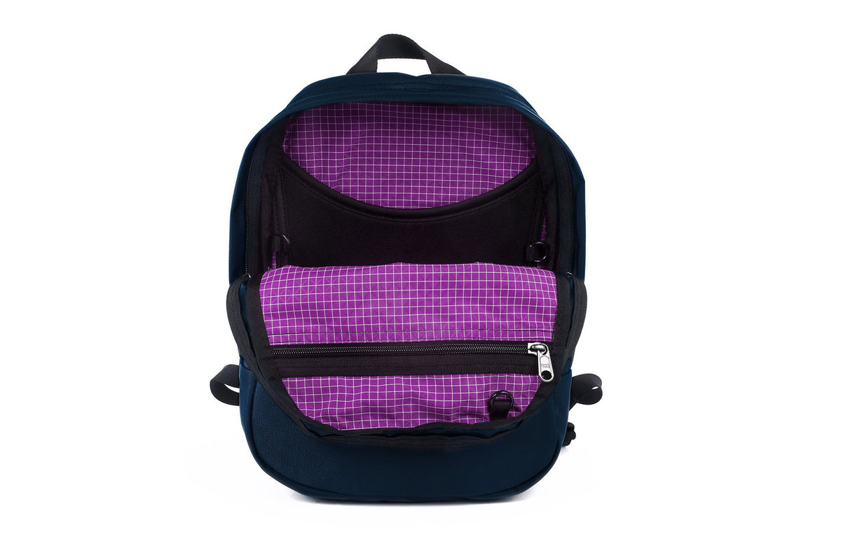 visible variant TB0126-DKUD^^The Zeitgeist with a Deep Blue (dark blue) 630 Ballistic exterior and Ultraviolet (purple with white grid) interior.