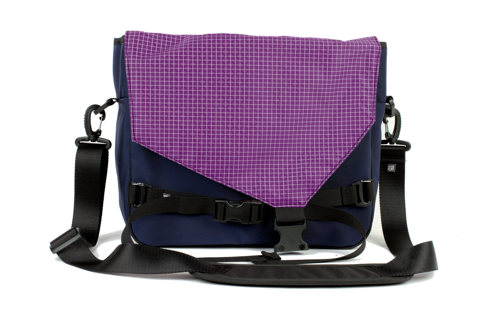 visible variant TB0204-DKUD^^The Maker's Bag in Deep Blue (dark blue) 525 Ballistic with a Ultraviolet (purple with white grid) Halcyon interior.