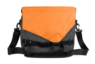 visible variant TB0204-GKZD^^The Maker's Bag in Nebulous Grey (Medium grey) Ballistic with a Zest (orange with white grid) 200 Halcyon interior.