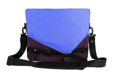 visible variant TB0204-UK9D^^The Maker's Bag in Aubergine (dark purple) Ballistic with a Selkie (purplish-blue with white grid) 200 Halcyon interior.