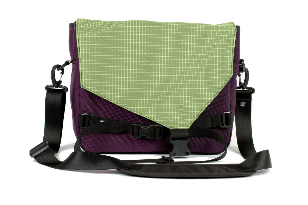 visible variant TB0204-UKHD^^The Maker's Bag in Aubergine (dark purple) Ballistic with a Honeydew (pale green with white grid) 200 Halcyon interior.