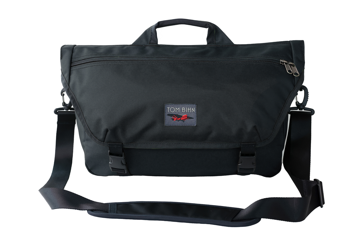 visible variant TB0210-BK9D^^The Marathon in Black Ballistic with a red label with the shoulder strap attached