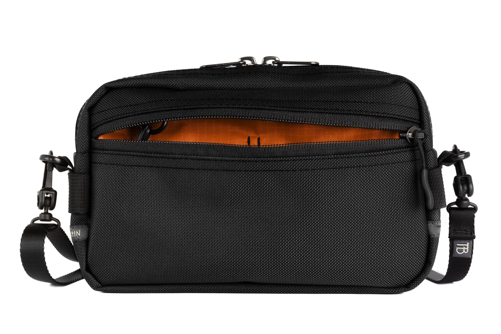 visible variant TB0413-BKPL^^A Side Effect in Black Ballistic with Persimmon (dark orange with orange grid) 210 Cerylon interior.
