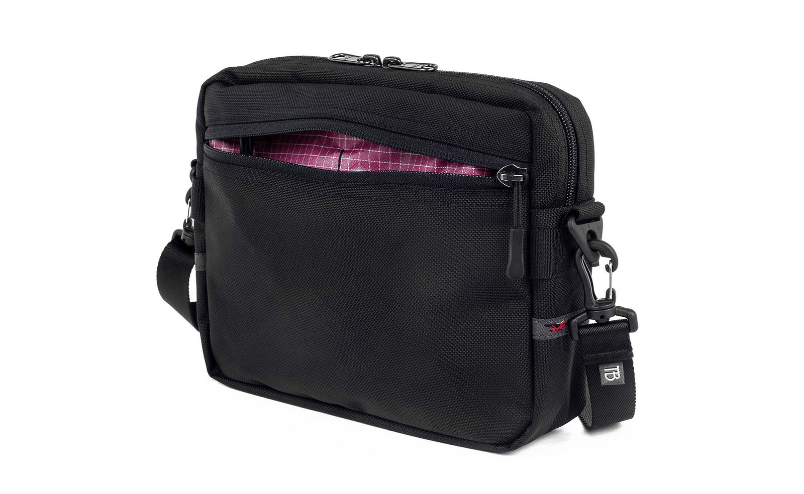 visible variant TB0414-BK5D^^The Side Kick in Black Ballistic with an Acai (dark purple with white grid) 200 Halcyon interior.
