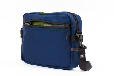 visible variant TB0414-DKML^^The Side Kick in Deep Blue (dark blue) Ballistic with an Moss (green with light green grid) 210 Cerylon interior.