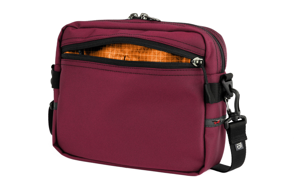 visible variant TB0414-PKZD^^The Side Kick in Raspberry (reddish purple) 630 Ballistic with a Zest (orange with white grid) 200 Halcyon interior.