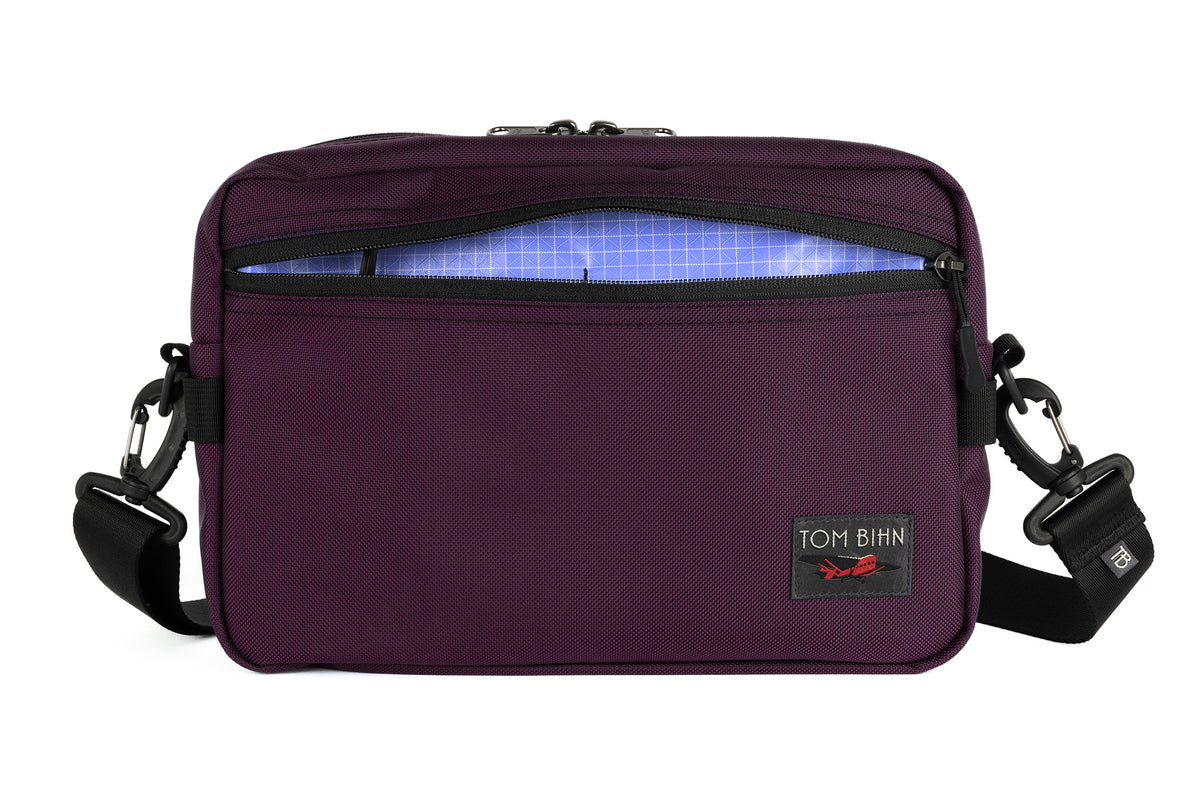 visible variant TB0415-UK9D^^The Side Hustle in Aubergine Ballistic with Selkie (purplish-blue) 200 Halcyon interior.
