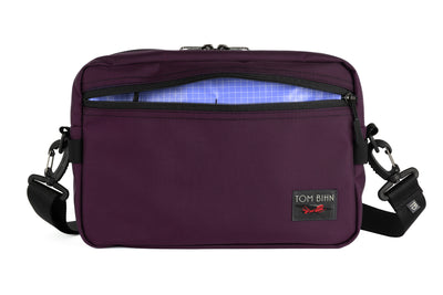 visible variant TB0415-UK9D^^The Side Hustle in Aubergine Ballistic with Selkie (purplish-blue) 200 Halcyon interior.