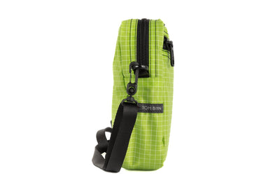 visible variant TB0416-1DGE^^Profile photo of an Everyday Cubelet in Kiwi Halcyon (bright green with a white grid) with a front zipper.