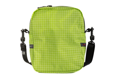 visible variant TB0416-1DGE^^Rear photo of an Everyday Cubelet in Kiwi Halcyon (bright green with a white grid) with a front zipper.