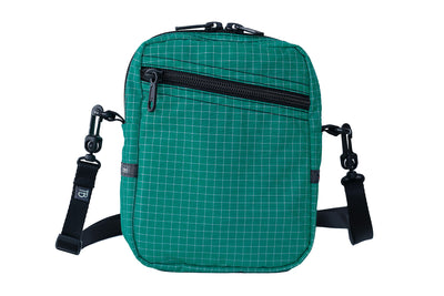 visible variant TB0416-EDGE^^An Everyday Cubelet in Kelpie Halcyon (bluish-green with a white grid) with a front zipper.