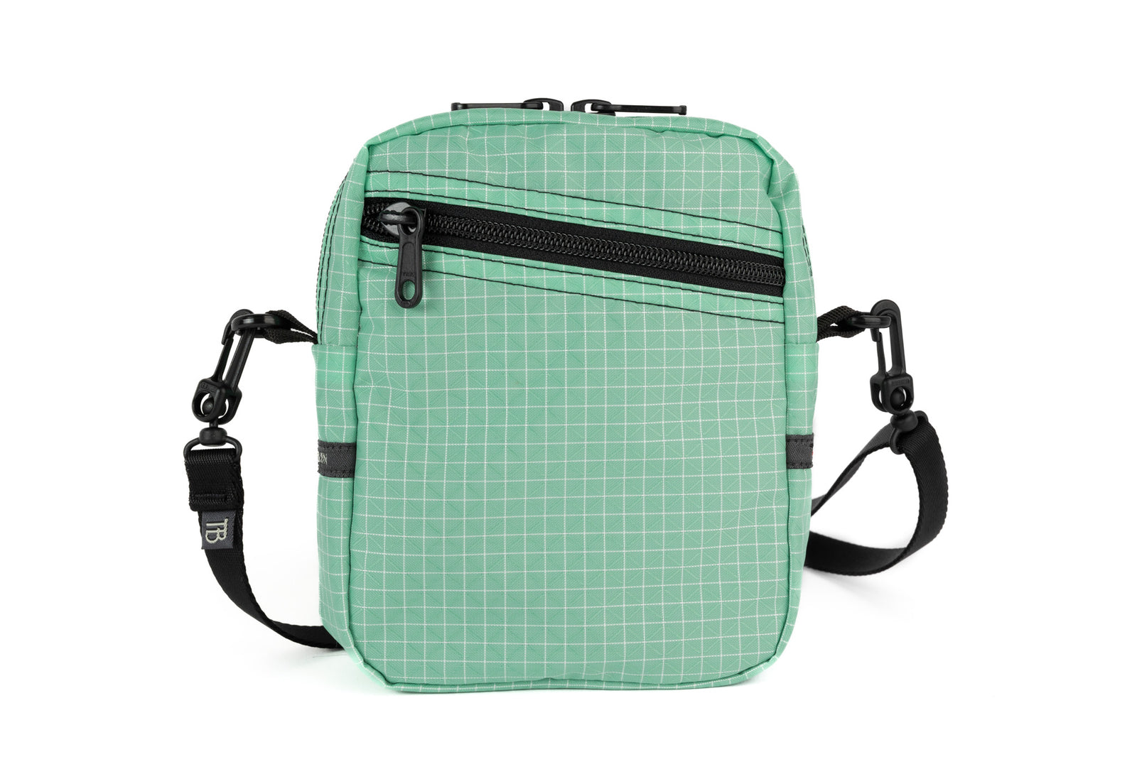 visible variant TB0416-GDGE^^An Everyday Cubelet in Seafoam Halcyon (green with a white grid) with a front zipper.
