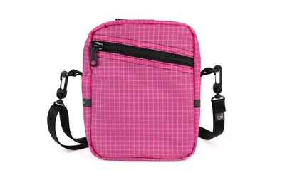 visible variant TB0416-PDGE^^An Everyday Cubelet in Cerise Halcyon (pink with a white grid) with a front zipper.