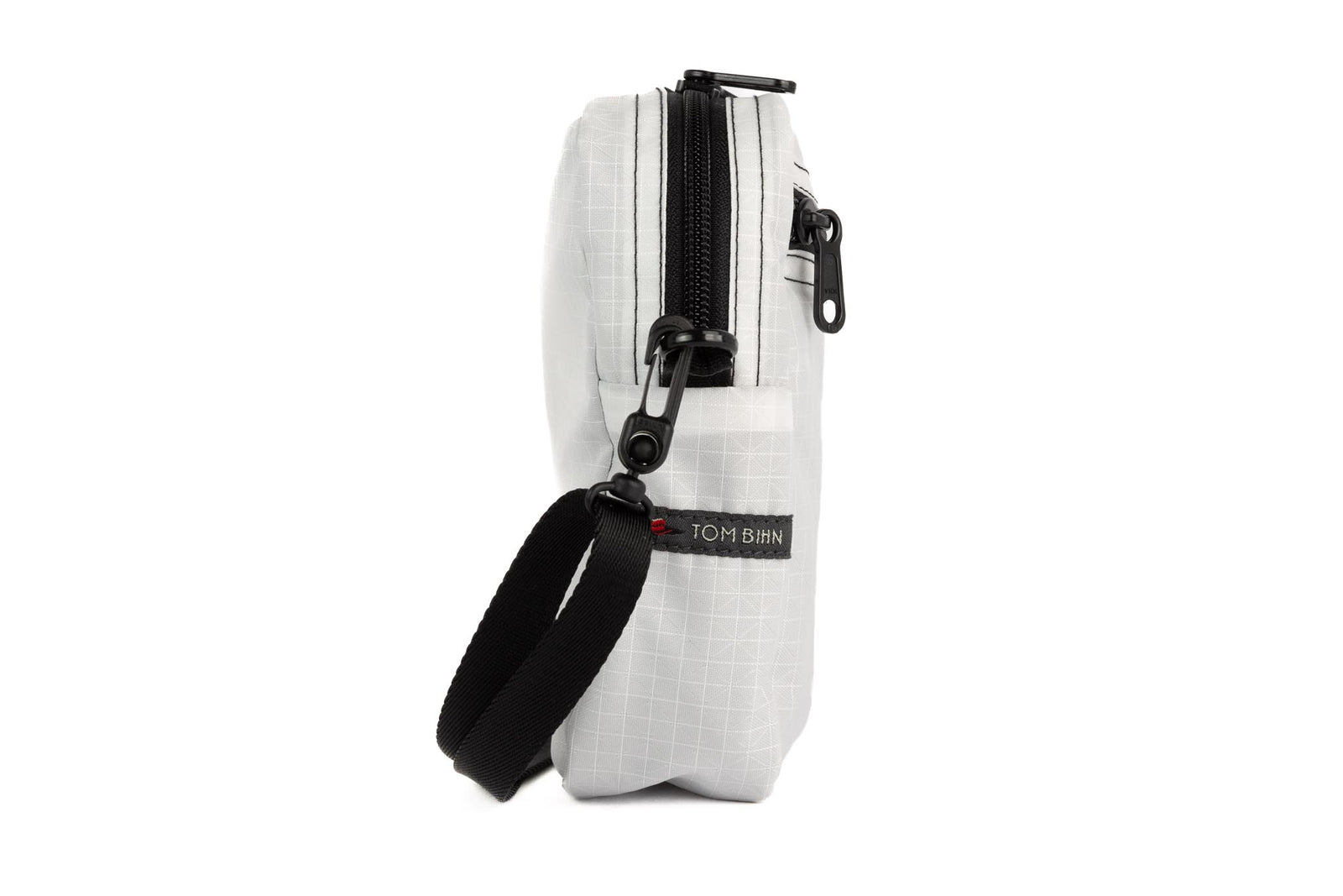 visible variant TB0416-TDGE^^A profile shot of an Everyday Cubelet in Tahoma Halcyon (white with a white grid) with a front zipper.