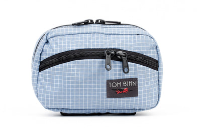 visible variant TB0418-7D^^The front of a Handy Little Thing #1 in Tidal (faded blue with white grid) 200 Halcyon showing the front zipper with two slider and logo at the bottom-right corner.