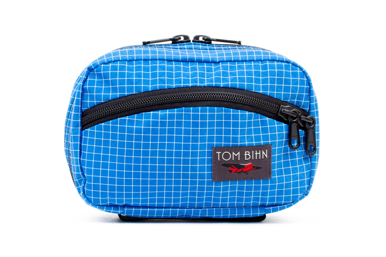 visible variant TB0418-LD^^The front of a Handy Little Thing #1 in Island (blue with white grid) 200 Halcyon showing the front zipper with two slider and logo at the bottom-right corner.