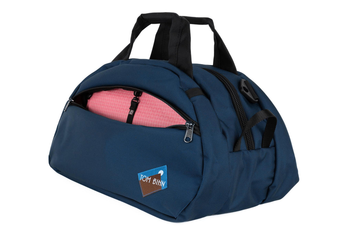 visible variant TB0435-DK4D^^The Old School Carry All in Deep Blue 630 Ballistic with Sakura (pale pink with white grid) 200 Halcyon interior.