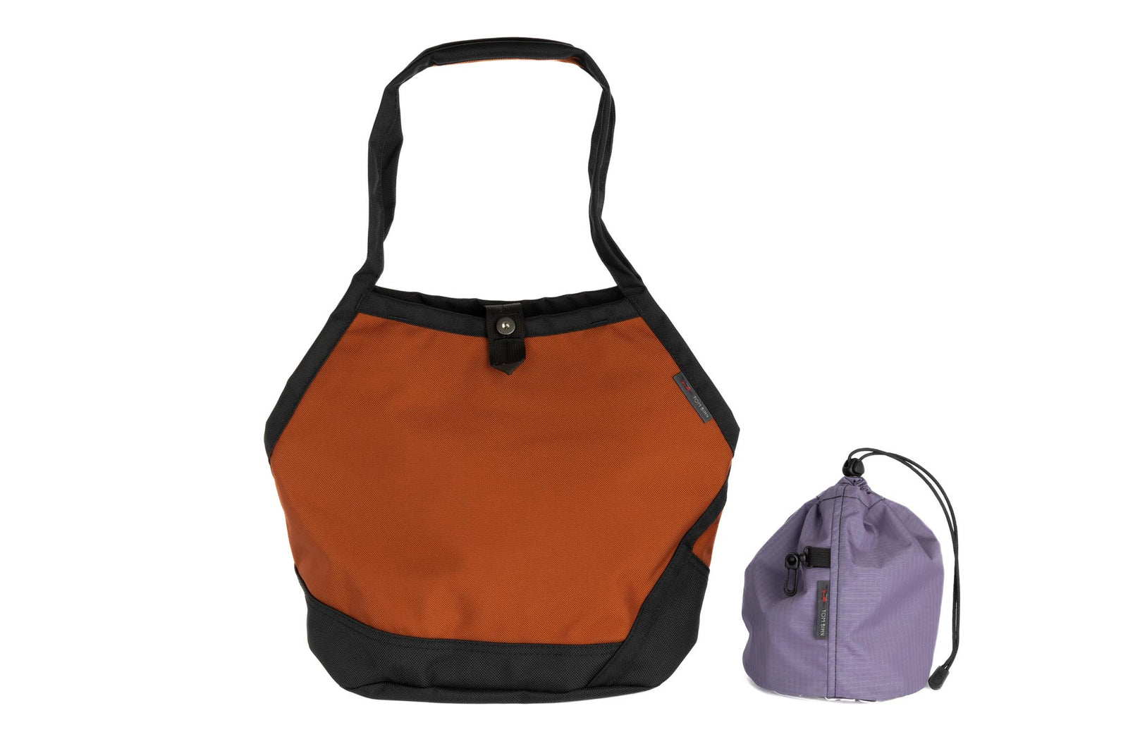 visible variant TB0660-TKDL^^The Swift in Burnt Orange Ballistic with a Dawn (blue-grey with dark blue-grey grid) interior and Medium Yarn Stuff Sack