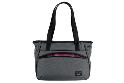 visible variant TB0715-GK5D^^Photo of the Nomad Tote in Nebulous Grey Ballistic with Zest (orange with white grid) 200 Halcyon interior.