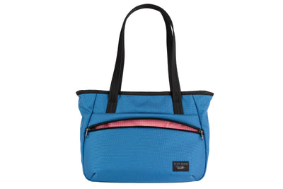 visible variant TB0715-NK4D^^Photo of the Nomad Tote in Constellation Ballistic with Sakura (pale pink with white grid) 200 Halcyon interior.