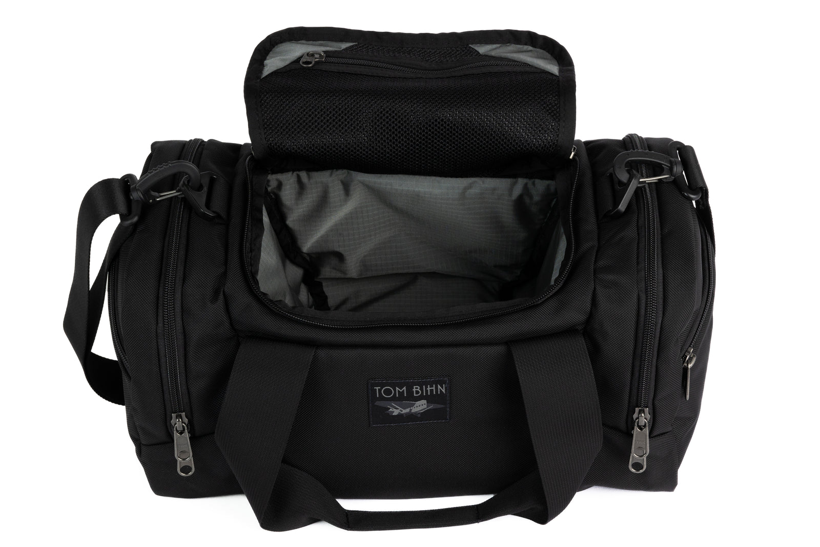 visible variant TB0904-BKGL^^The Night Flight Travel Duffel in Black Ballistic with a Mountain Grey 210 Cerylon interior.