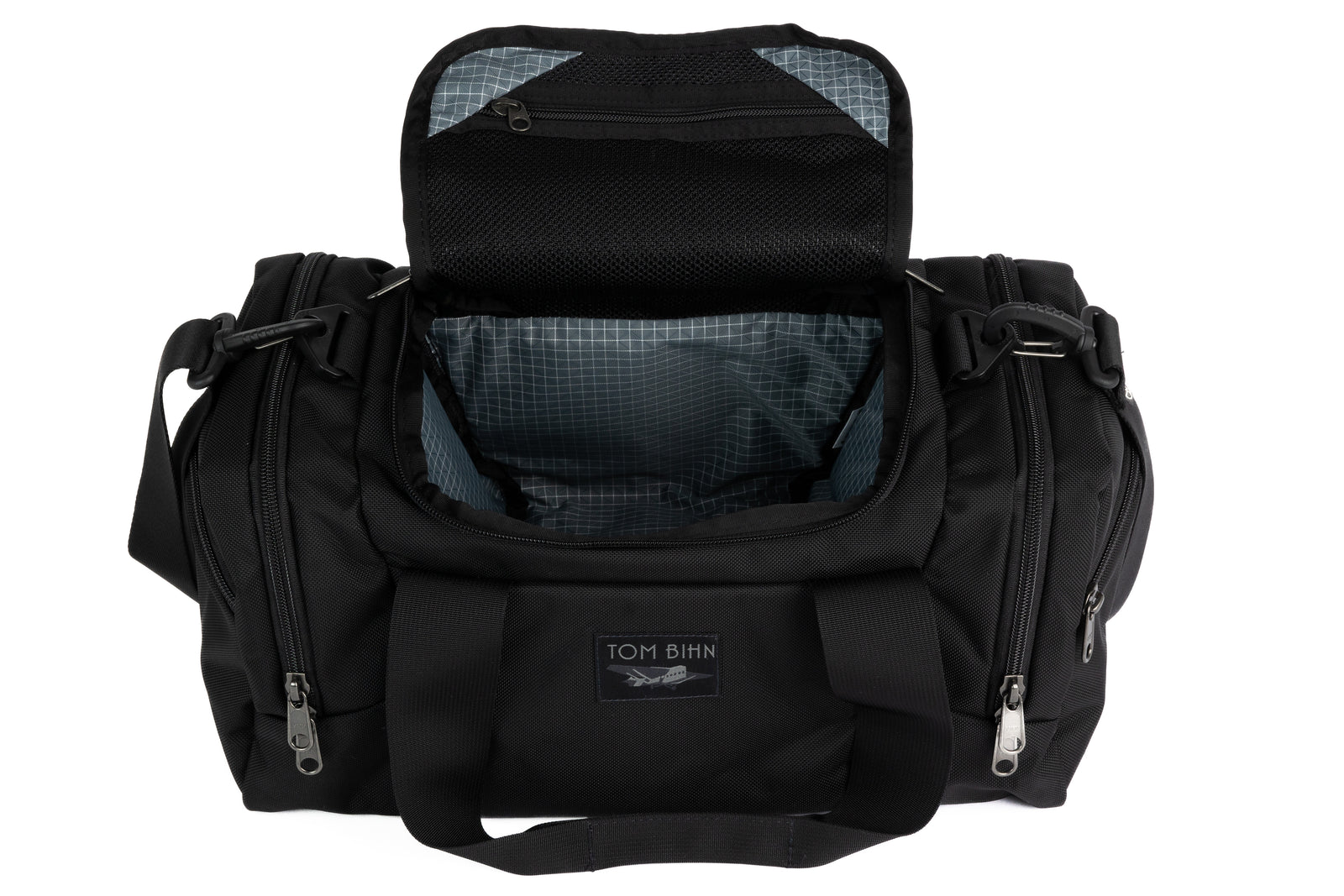 visible variant TB0904-BKND^^The Night Flight Travel Duffel in Black Ballistic with a Northwest Sky 210 Cerylon interior.