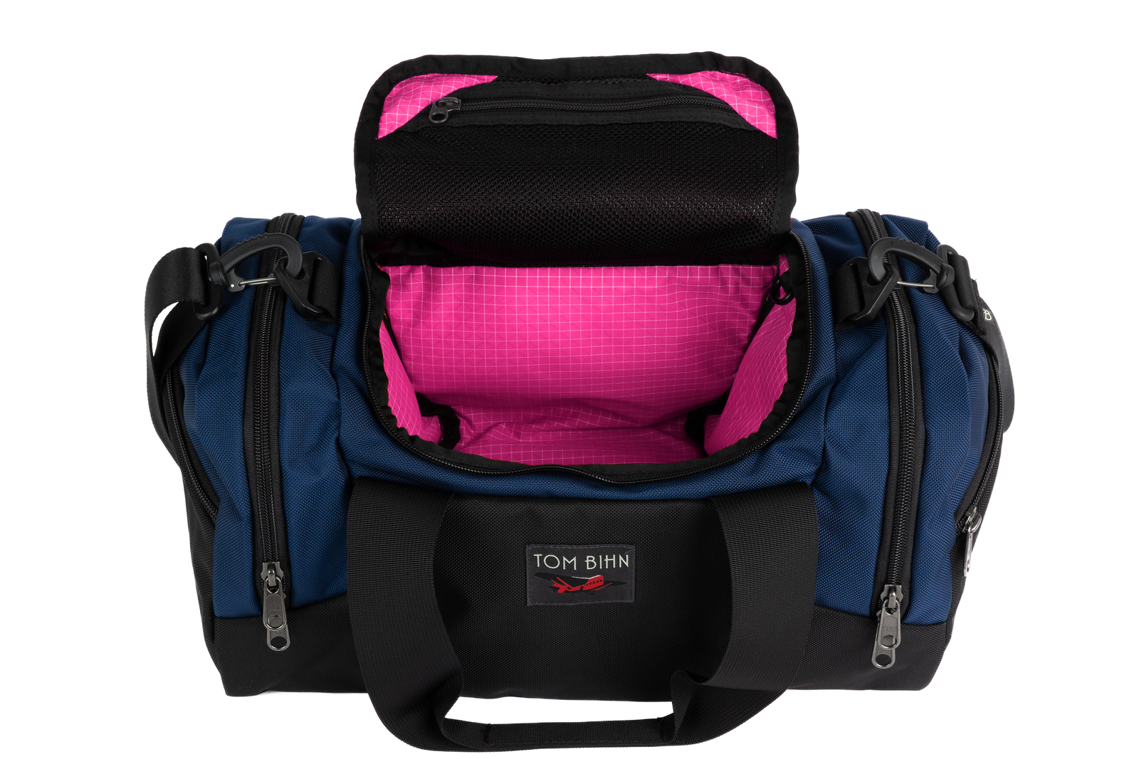 visible variant TB0904-DKPD^^The Night Flight Travel Duffel in Deep Blue Ballistic with a Cerise 200 Halcyon interior.