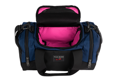 visible variant TB0904-DKPD^^The Night Flight Travel Duffel in Deep Blue Ballistic with a Cerise 200 Halcyon interior.