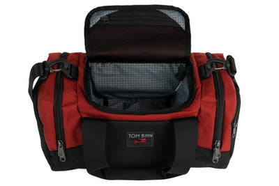 visible variant TB0904-MKND^^The Night Flight Travel Duffel in Mars Red Ballistic with a Northwest Sky 200 Halcyon interior.