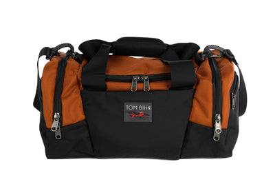 visible variant TB0904-TKGL^^The Night Flight Travel Duffel in Burnt Orange Ballistic.