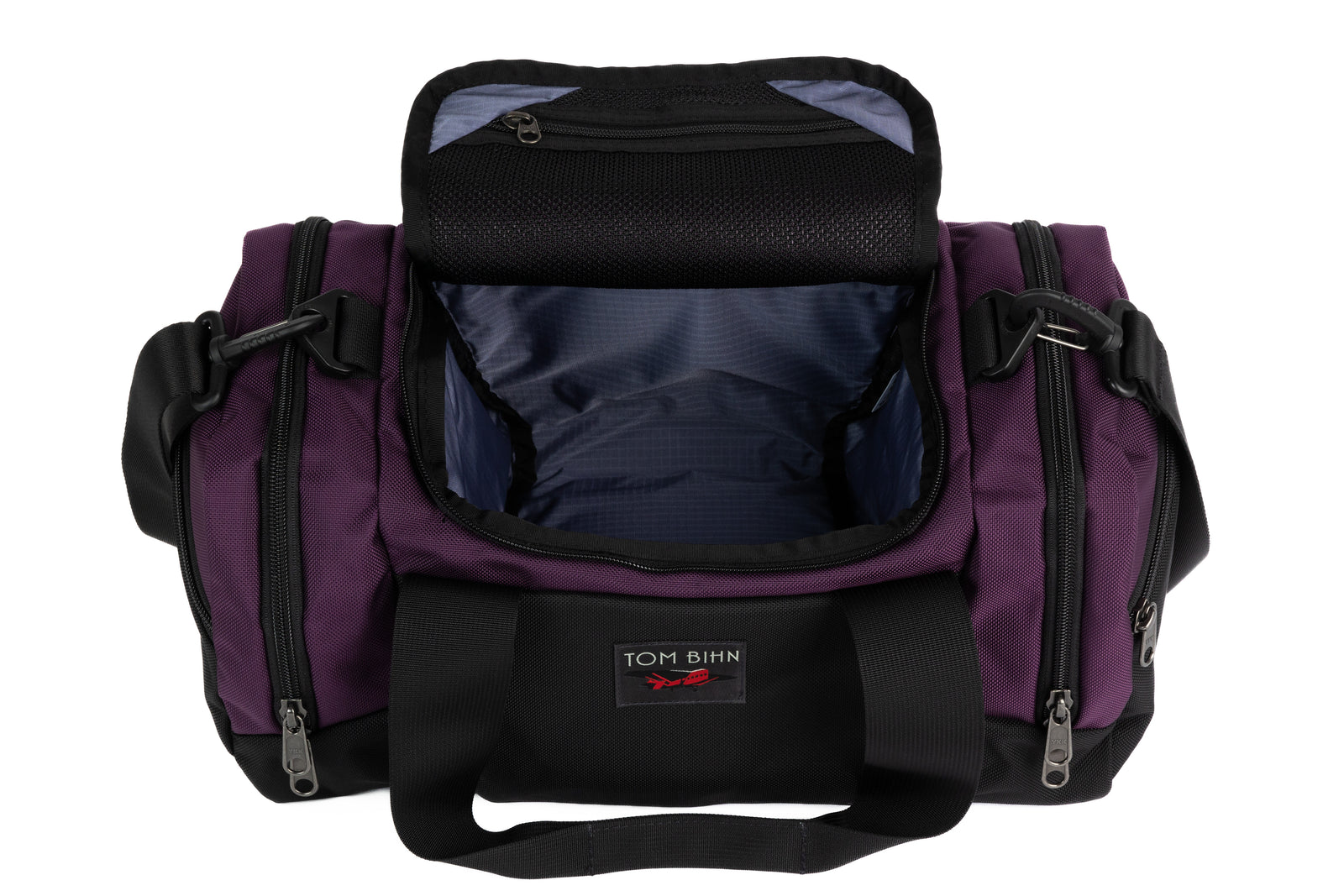 visible variant TB0904-UKDL^^The Night Flight Travel Duffel in Aubergine Ballistic with a Dusk 210 Cerylon interior.