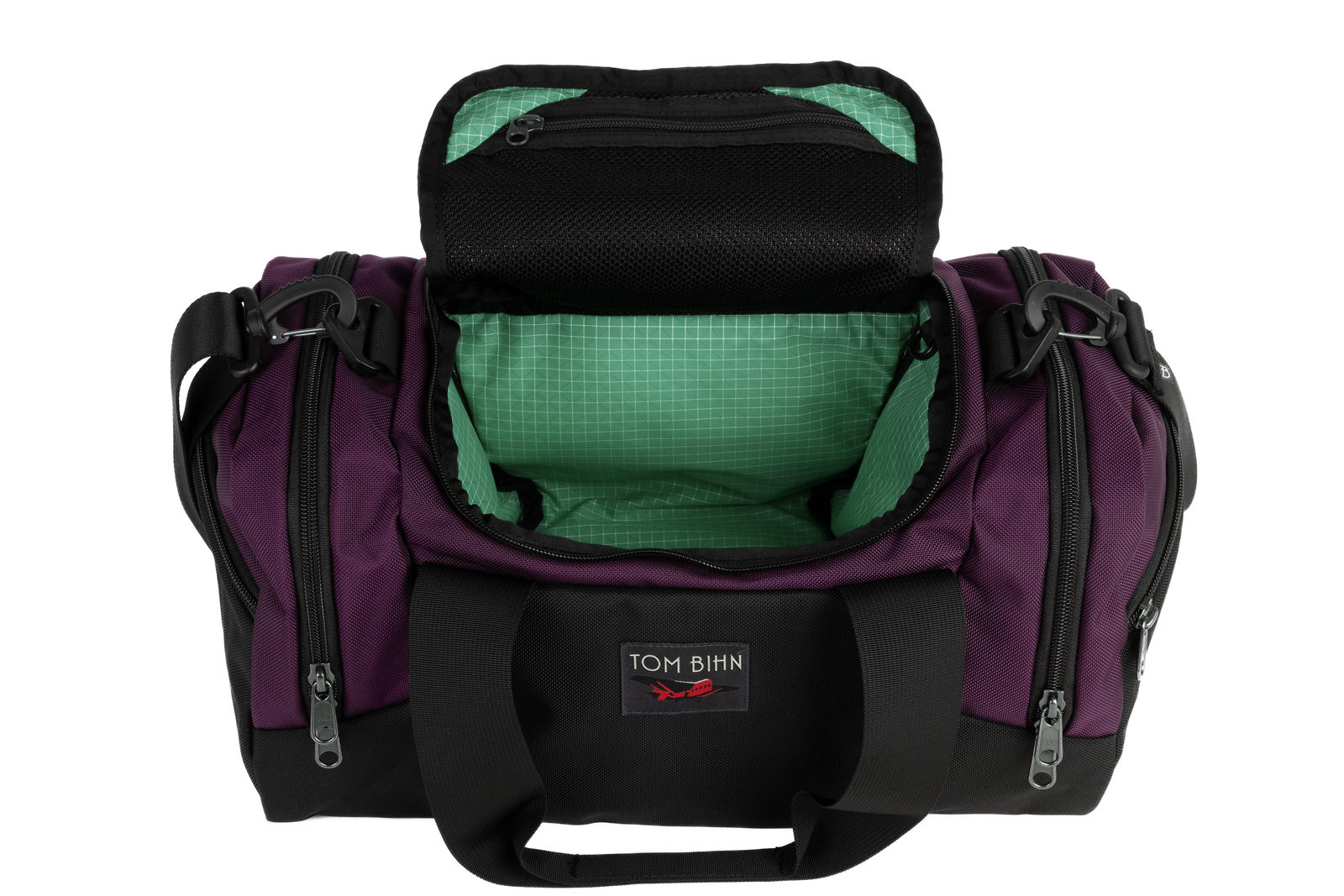 visible variant TB0904-UKGD^^The Night Flight Travel Duffel in Aubergine Ballistic with a Seafoam 200 Halcyon interior.
