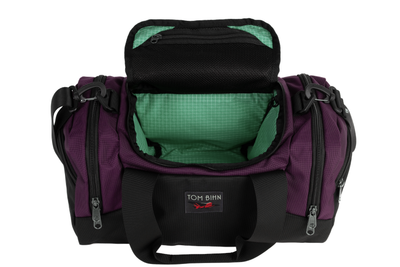 visible variant TB0904-UKGD^^The Night Flight Travel Duffel in Aubergine Ballistic with a Seafoam 200 Halcyon interior.