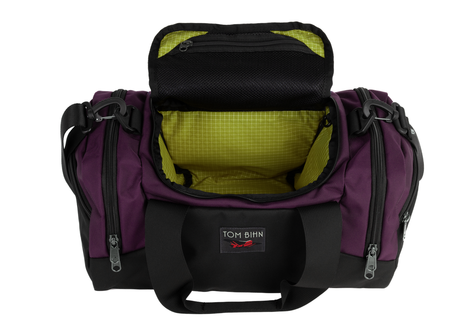 visible variant TB0904-UKWD^^The Night Flight Travel Duffel in Aubergine Ballistic with a Wasabi 200 Halcyon interior.